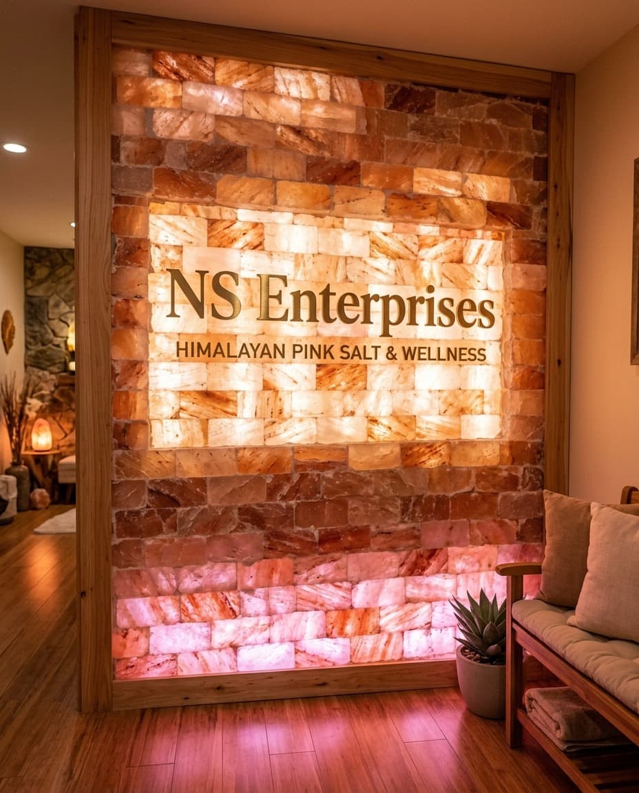 A backlit NatCore Enterprises Himalayan pink salt brick wall in a wellness reception